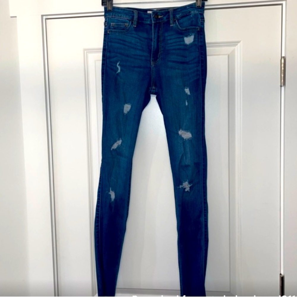 Hollister medium wash destructed denim. Raw hem. Skinny high rise.
